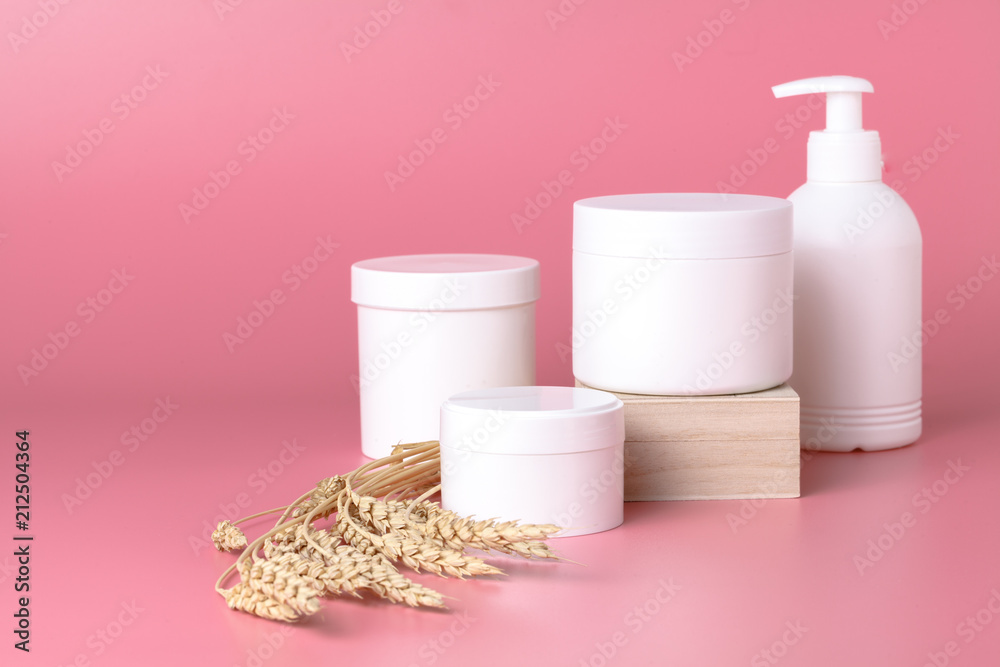 Natural cosmetics and leaves on pink background Natural cosmetics and leaves on pink background