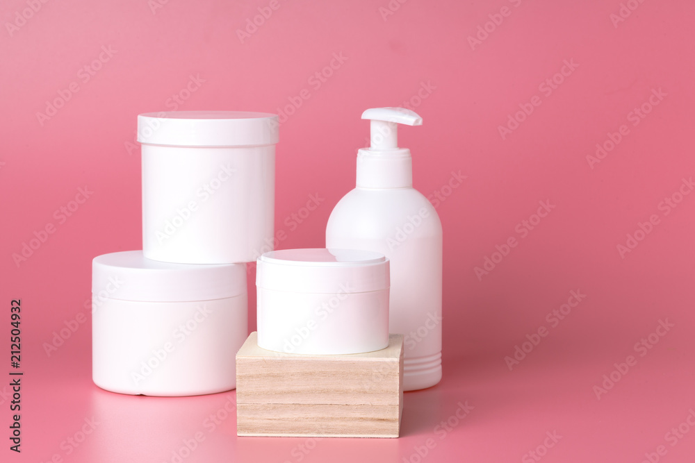 Few cosmetic bottle on pink background, mockup Few cosmetic bottle on pink background, mockup