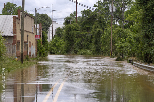 River Overflows Flooding a Road