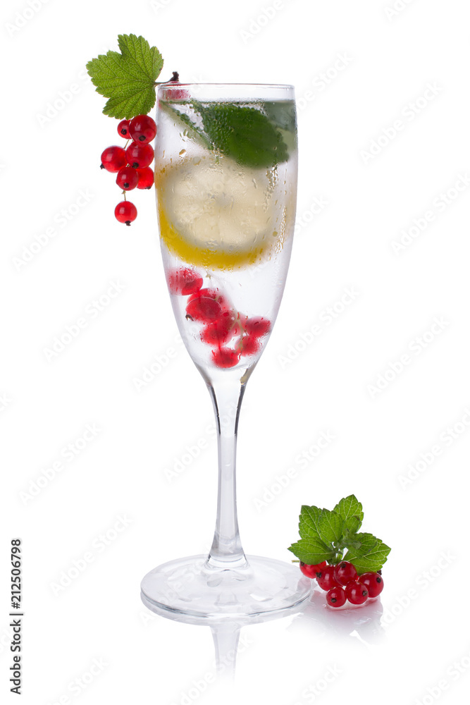 refreshing glass of water with lemon Red currant isolated on white in a glass for champagne refreshing glass of water with lemon Red currant isolated on white in a glass for champagne