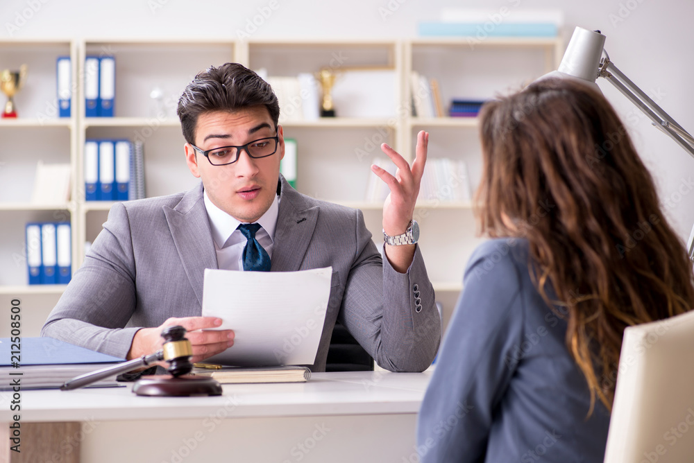 Lawyer discussing legal case with client Lawyer discussing legal case with client