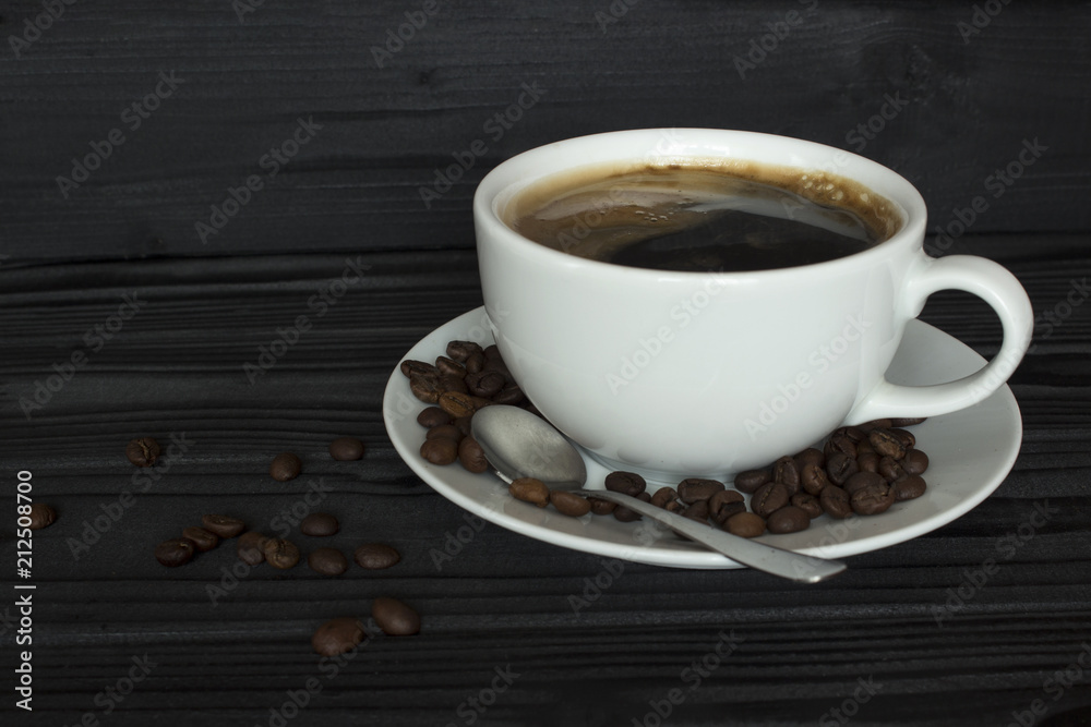 coffee in a white cup, spoon, coffee beans coffee in a white cup, spoon, coffee beans