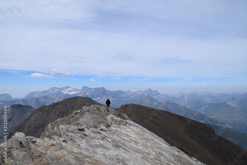 man walking on the mountain ridge