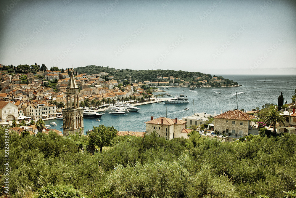 View of Hvar in Croatia. Vintage style photo with black gold filter
