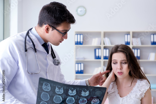Woman with neck injury visiting doctor for check-up