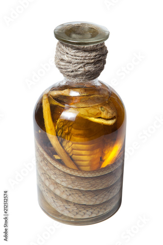 Photography Bottle of alcohol containing a cobra snake isolated white background