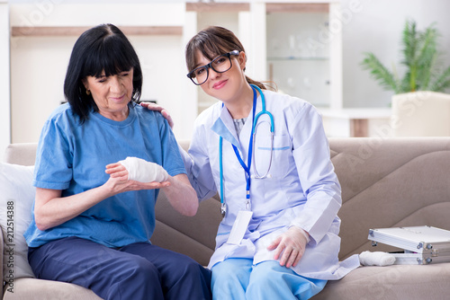 Doctor examining old mature woman after incident © Elnur