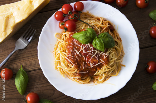 spaghetti bolognese with tomato sauce, cheese and basil