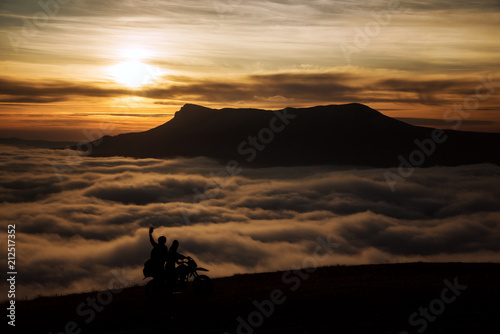 Two tourists motorcyclist in the mountains. Demerdzhi, Crimea. 2016-03-07