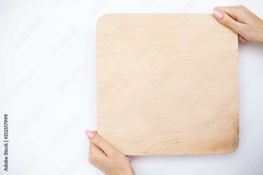 Obraz premium Office Woman Hands Holding a A Tree Board on White Background. Copyspace. Place for Text
