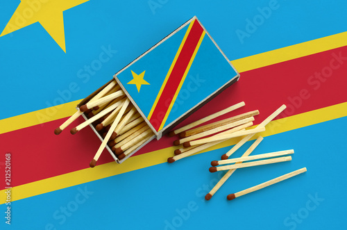 Democratic Republic of the Congo flag  is shown on an open matchbox, from which several matches fall and lies on a large flag photo