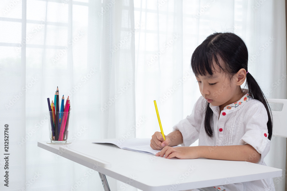 Asian Little Chinese girl doing homework Asian Little Chinese girl doing homework