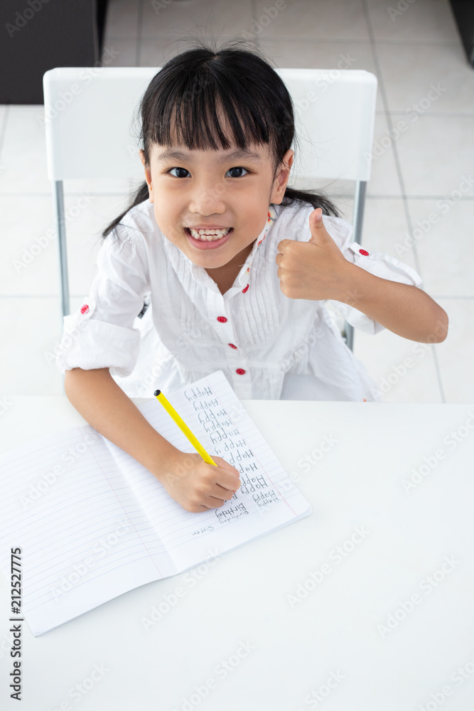 Asian Little Chinese girl doing homework Asian Little Chinese girl doing homework