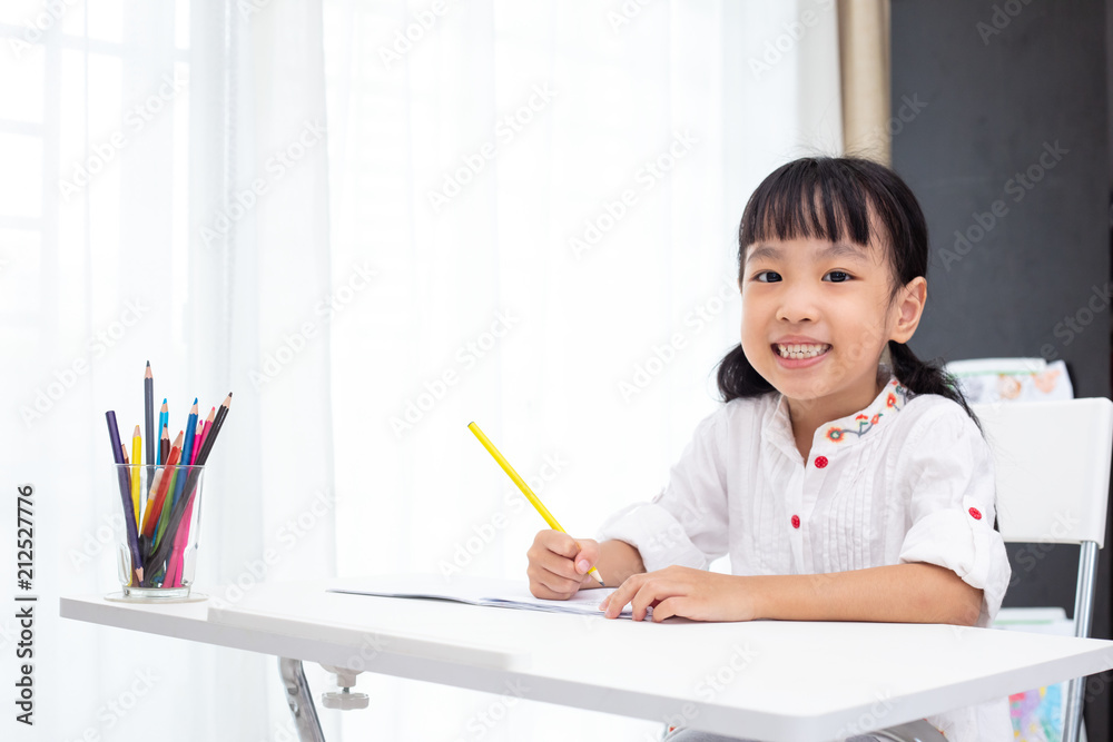 Asian Little Chinese girl doing homework Asian Little Chinese girl doing homework
