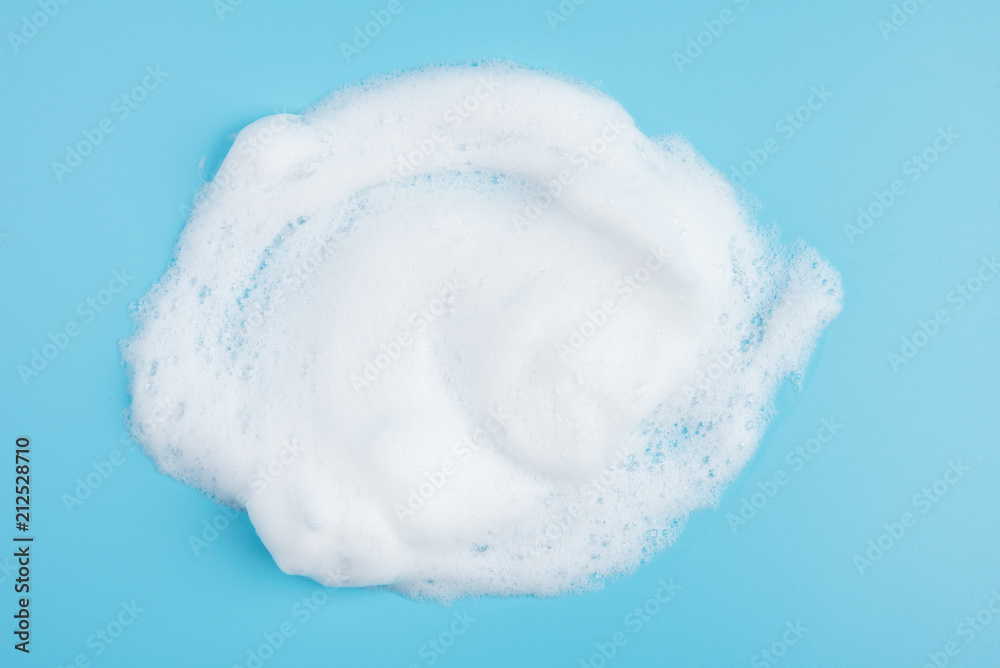 Foam bubble on blue background on top view object beatuy health care concept design Foam bubble on blue background on top view object beatuy health care concept design