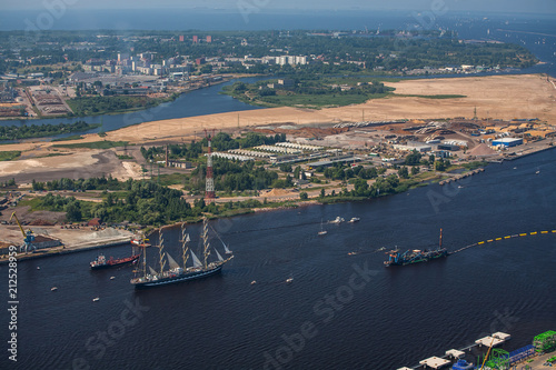 A large sailboat goes along the water area of the Daugava River. The last windjammer bark Kruzenstern.