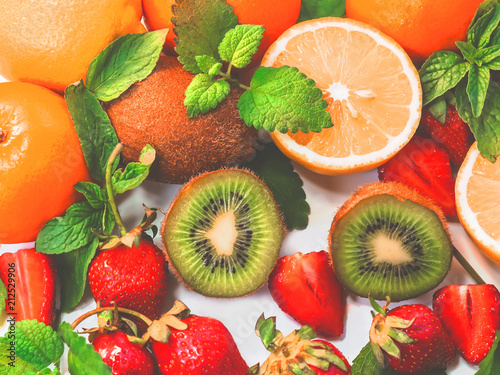 Fototapeta Naklejka Na Ścianę i Meble -  citrus fruits and strawberries on white background