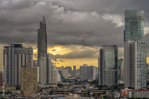 Closeup scene of bangkok cityscape with cloud when storm is coming when sunset time, Nature and city concept