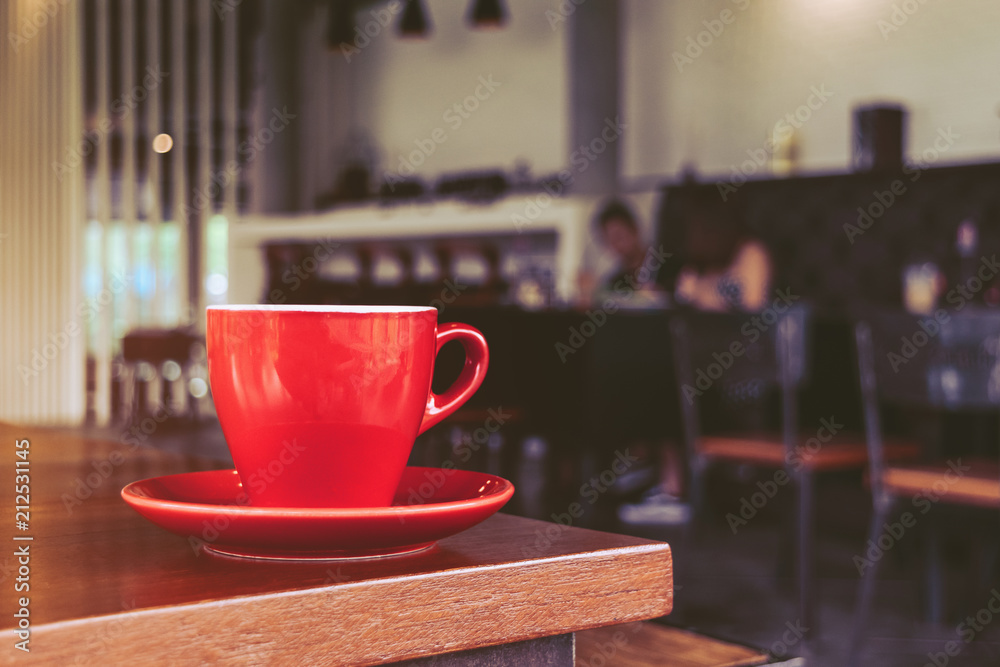 Fototapeta premium red coffee cup in cafe, on morning