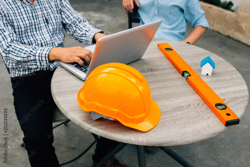 Engineer and Architect planing and discuss at Construction Site with blueprint Engineer and Architect planing and discuss at Construction Site with blueprint