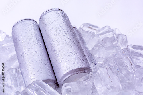 Aluminum beverage drink can in ice isolated on white background. Metal color for your design..