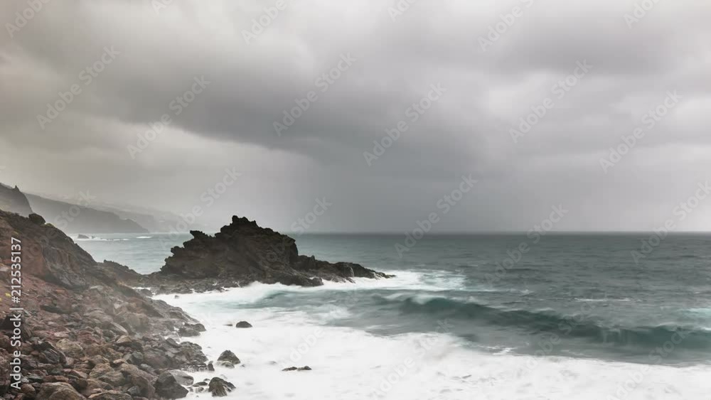 Timelapse sequence of storm and rain with tall waves hitting the rocks at Playa de Nogales beach in La Palma, Spain in 4K. Timelapse sequence of storm and rain with tall waves hitting the rocks at Playa de Nogales beach in La Palma, Spain in 4K.