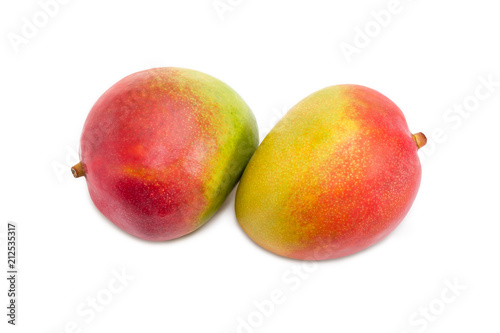 Two mango fruit on a white background