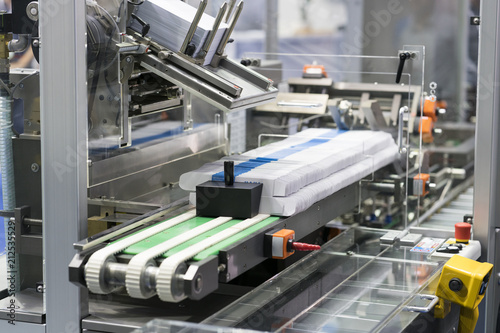 Automatic packing machine with plastic bag and paper box