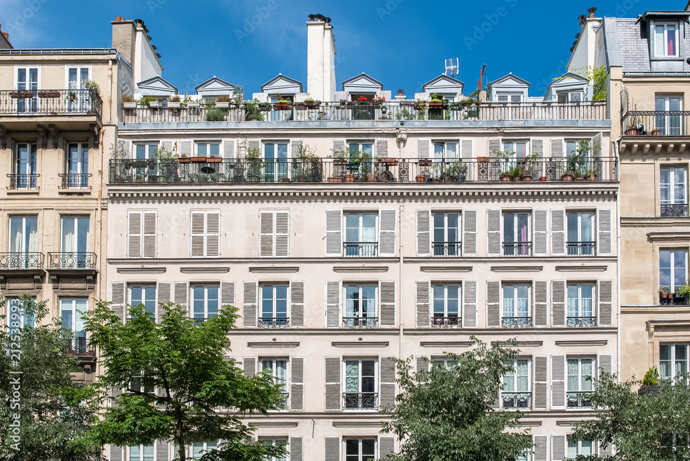 Paris, beautiful building in the center, typical parisian facade in the Marais
