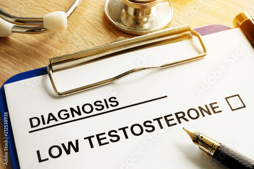 Diagnosis Low testosterone and pen on a desk. photo