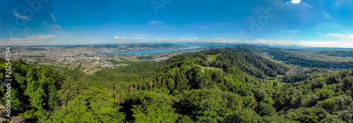 Panoramic view of Zurich lake and Alps from the top of Uetliberg mountain, from the observation platform on tower on Mt. Uetliberg, Switzerland, Europe