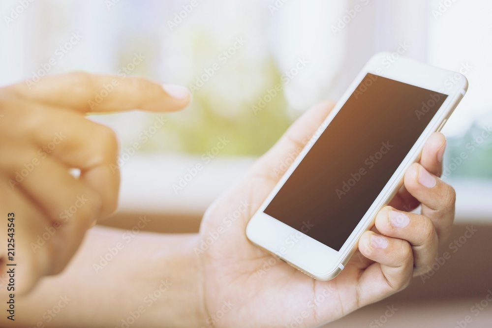 close up people man of hand holding white mobile smart phone with blank empty screen. empty space for text. Technology concept.