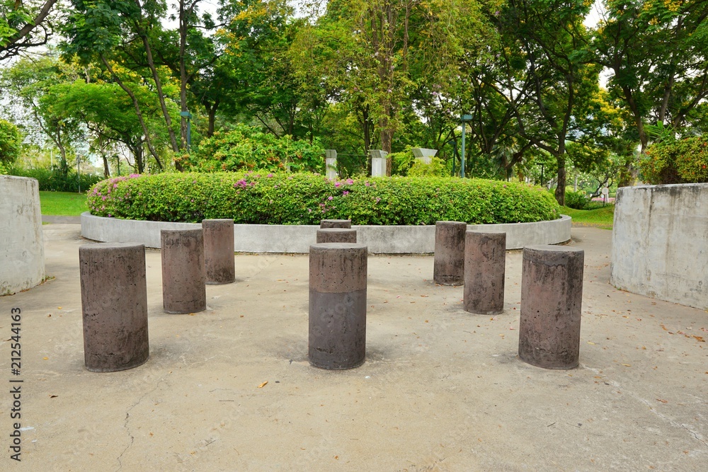 Small poles with tree and flowers in the Benjakiti Park at Bangkok, Thailand, space for your text.