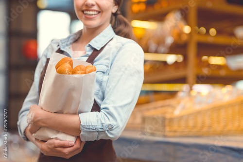 Young girl in uniform with baguettes