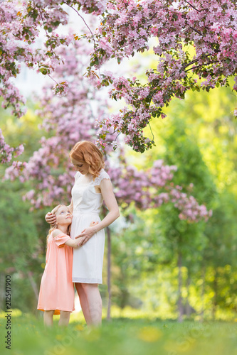 Mother and daughter in a garden
