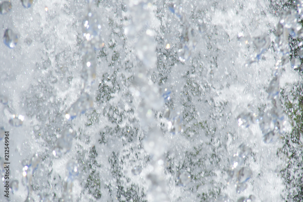 a torrent of white foam and spray; fountain close-up