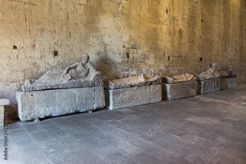 Fototapeta Tuscania, Viterbo, Italy: interior of San Pietro Church with sarcophagus