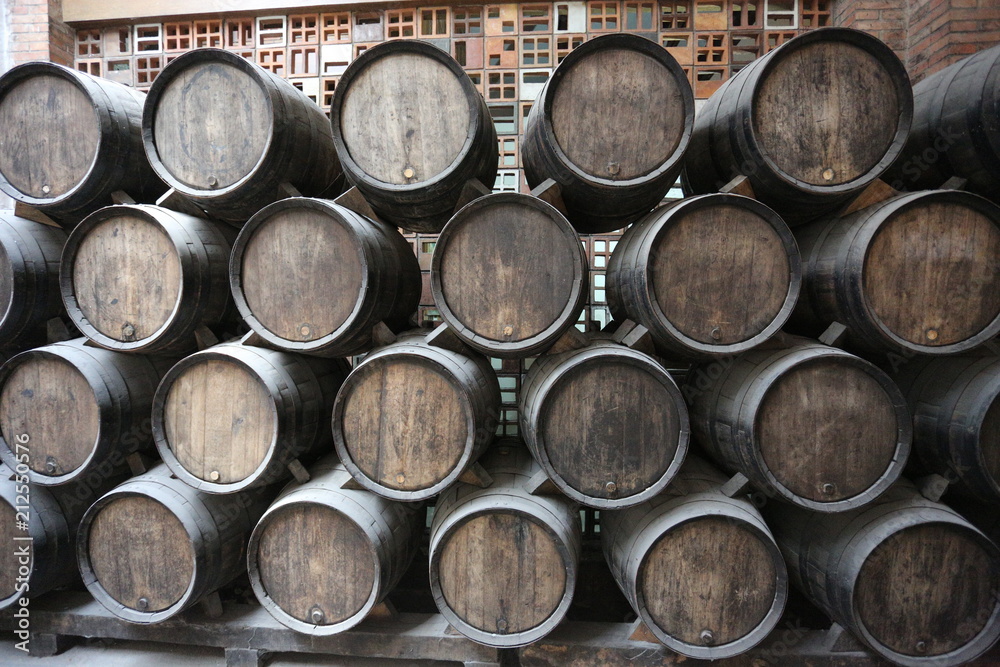 Old barrels for aging wine in the cellar