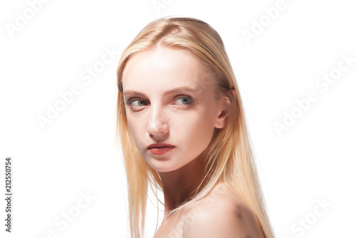 Portrait of a beautiful blonde on a white background.