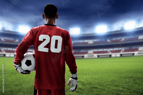 Soccer goalkeeper holding soccer ball