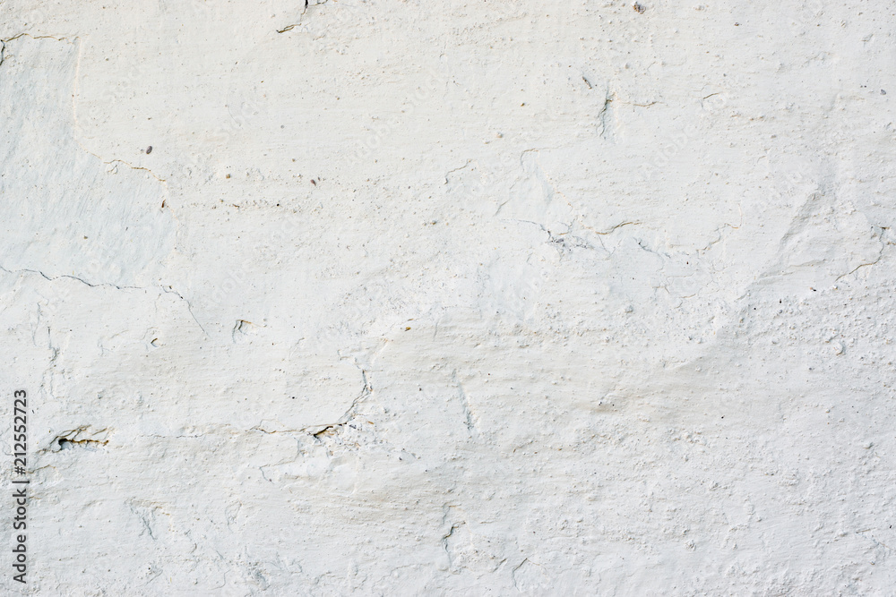 Closeup fragment of white shabby stone wall Closeup fragment of white shabby stone wall