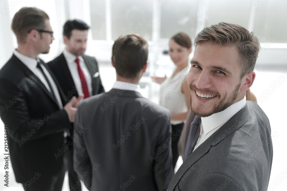 successful businessman on blurred office background