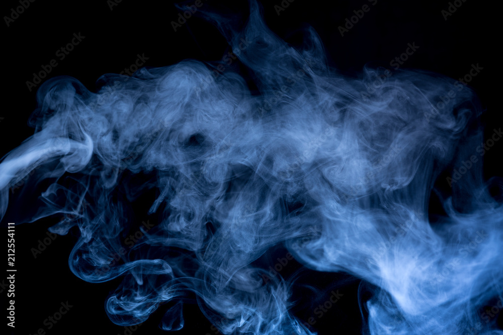 Fototapeta premium Blue smoke isolated on black background.