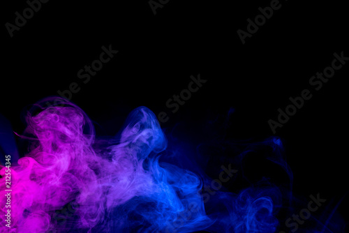 Red and blue smoke isolated on black background.