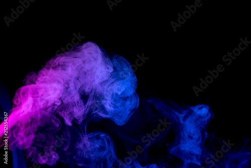 Red and blue smoke isolated on black background.
