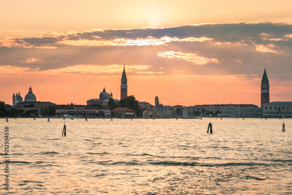 sunset over Venetian lagoon with Venice skyline in background