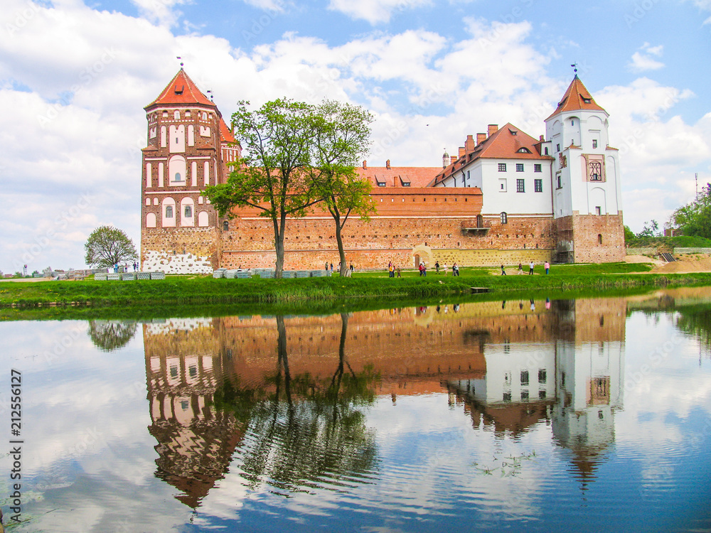 Mir, Belarus. Castle Complex Mir On Sunny Day with blue sky Background. Old medieval Towers and walls of traditional fort from unesco world heritage list