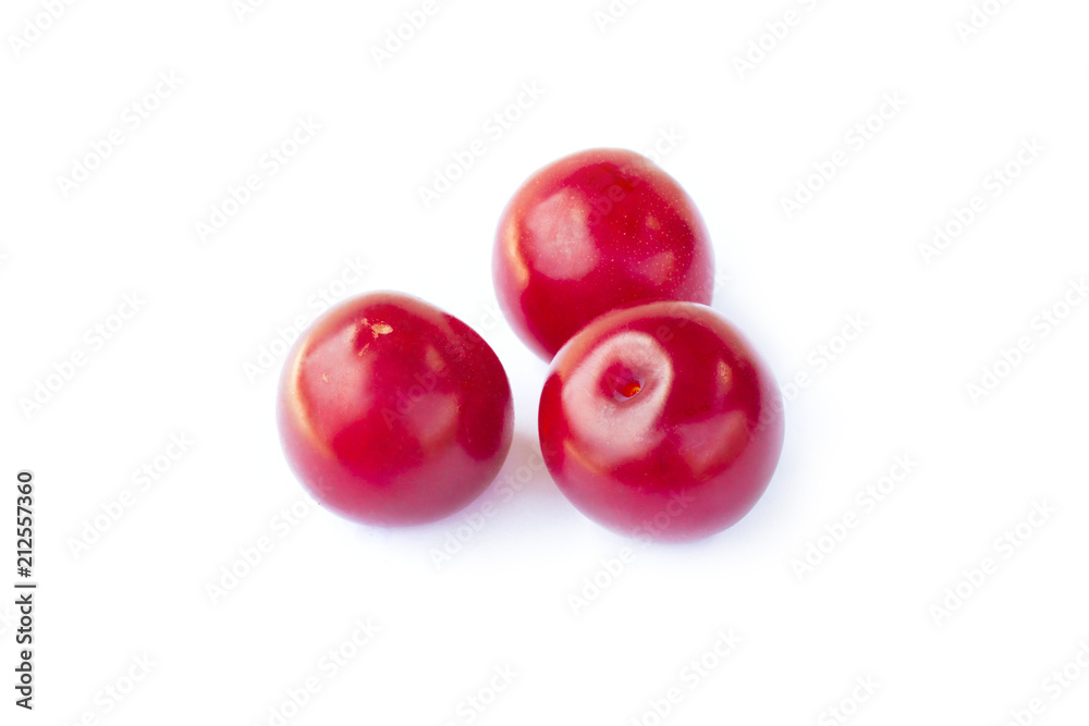 Fresh sweet cherry plums fruit, three juicy ripe red cherry-plums, closeup, isolated on the white background Fresh sweet cherry plums fruit, three juicy ripe red cherry-plums, closeup, isolated on the white background