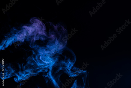 Blue smoke isolated on black background.