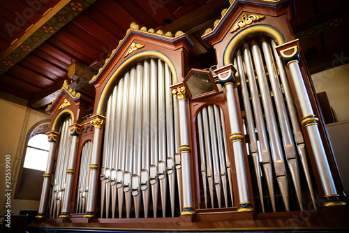 The organ in the church made of wood old and restored